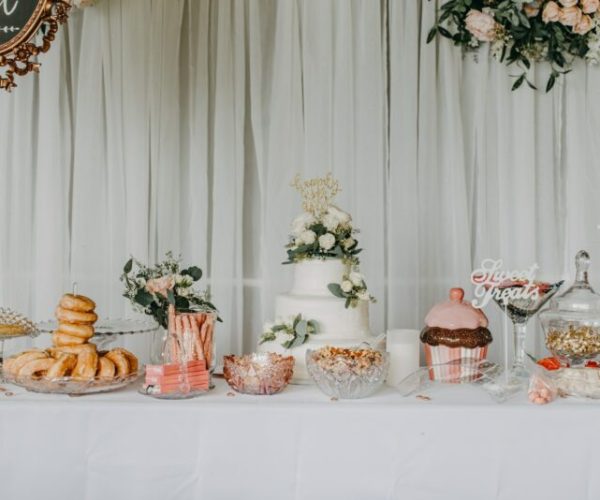 Wedding reception details. Wedding cake, donuts and other sweet treats.